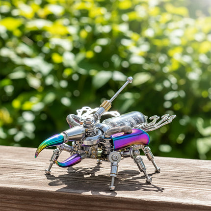  A vibrant steampunk mechanical beetle maquette en metal featuring iridescent rainbow details, presented as a complex 3D metal model kit. It's elegantly displayed on a wooden surface against a backdrop of sun-dappled green leaves, making it a unique steampunk puzzle.