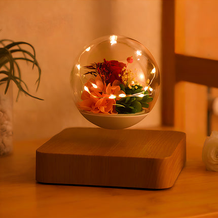 Magnetic levitating preserved flower globe with warm fairy lights, creating a romantic ambiance