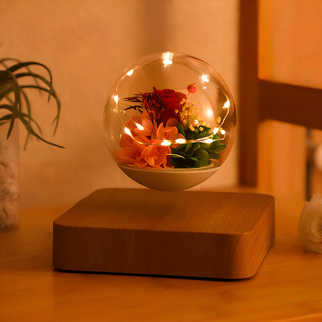 Magnetic levitating preserved flower globe with warm fairy lights, creating a romantic ambiance