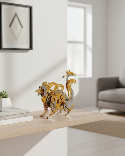 The gold and silver metallic玄武3D puzzle sits on a modern-style shelf alongside books and succulent plants. This eye-catching DIY metal model makes for an interesting desktop or home decor piece