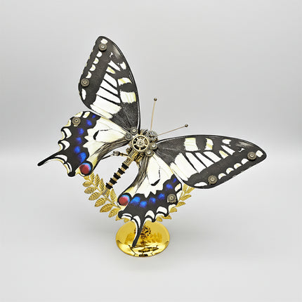 A majestic steampunk puzzle, a mechanical swallowtail butterfly with striking black, white, and blue patterned wings, elegantly poised on a golden stand against a clean background. This intricate metal model highlights sophisticated mechanical steampunk design, making it an impressive 3D puzzle Metal Kit for hobbyists or a captivating steampunk mech decorative piece that showcases its vibrant coloration and detailed craftsmanship from a dynamic angle.