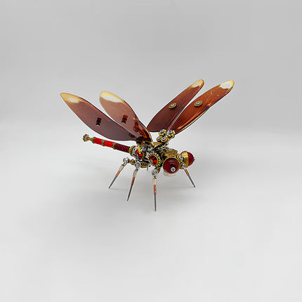 A striking steampunk puzzle, a mechanical dragonfly with rich reddish-brown wings and a detailed red and brass body, prominently displayed against a clean white background. This intricate metal model showcases a classic mechanical steampunk design, making it a captivating 3D puzzle Metal Kit for enthusiasts or a bold steampunk mech decorative piece that exudes vintage industrial elegance.
