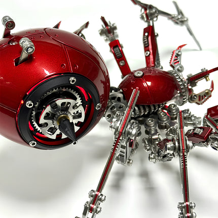 Side view of an assembled red mechanical spider metal model, highlighting its spherical body, articulated mechanical steampunk legs, and glowing accents. This detailed 3D puzzle metal kit is an intricate steampunk puzzle.