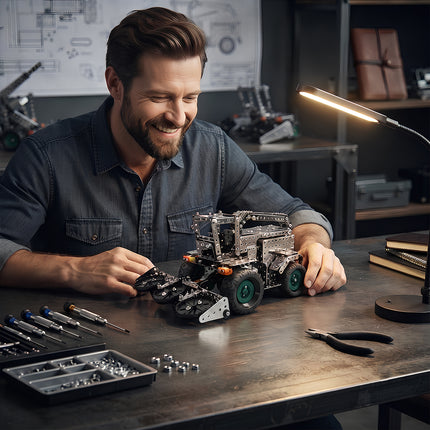 Assembled 3D metallic combine harvester puzzle kit with gear cutting head displayed in a professional maker workshop setting.