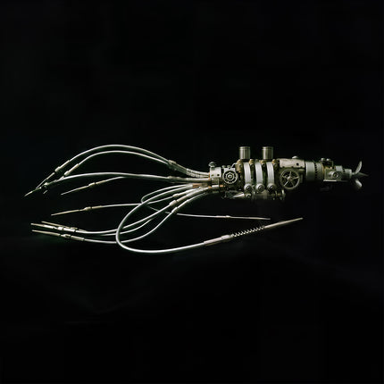 Horizontal side view of an assembled 3D metal mechanical squid model with articulated metallic tentacles on a solid black background.