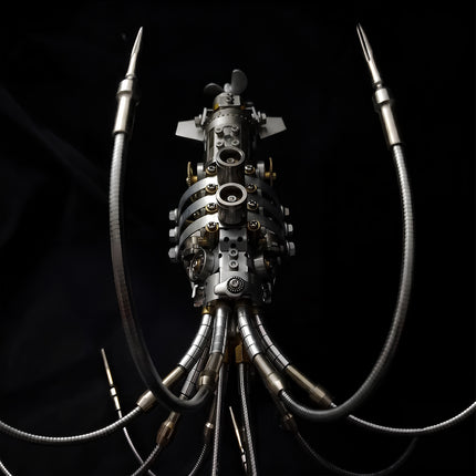 Vertical top-down view of an assembled 3D metal mechanical squid model displaying symmetrical tentacles, body gears, and rear propeller on a dark background.
