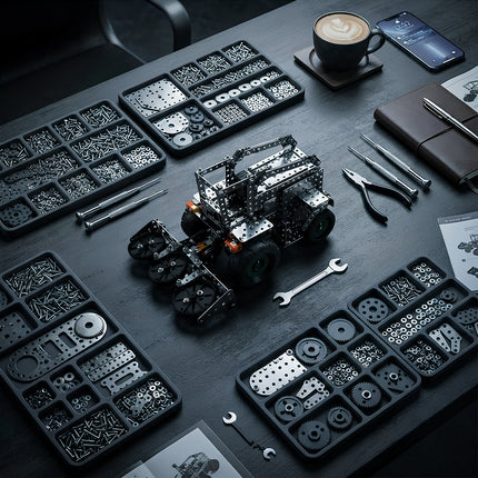 Aesthetic desk setup featuring a built DIY metal mechanical combine harvester model kit with classified screws, gears, and professional assembly tools.