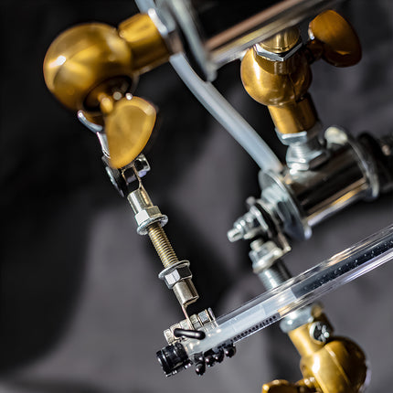 Detailed macro photography of 3D puzzle metal kits focusing on the high-quality mechanical assembly joints and metal parts.