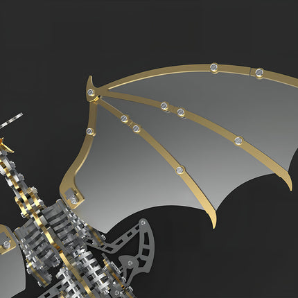 Close-up of the metal model dragon's wing, highlighting its mechanical steampunk design with golden frames and silver membranes. This 3D puzzle metal kit features intricate components for a detailed steampunk puzzle.
