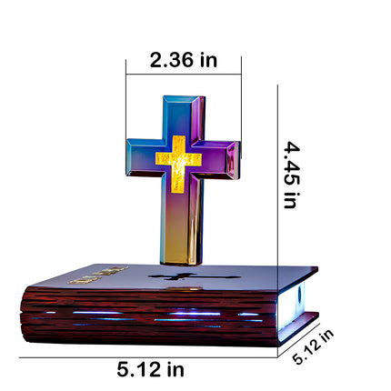  Levitating cross on a bible base, a unique spiritual home decor piece, perfect for a funny table display. Dimensions shown: 5.12 x 5.12 x 4.45 inches.