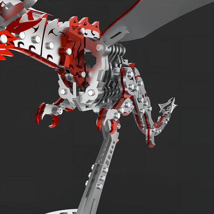 Close-up of the metal model dragon's body, highlighting its intricate mechanical steampunk joints, vibrant red and silver scales, and detailed leg structure. This 3D puzzle metal kit provides a challenging steampunk puzzle assembly.