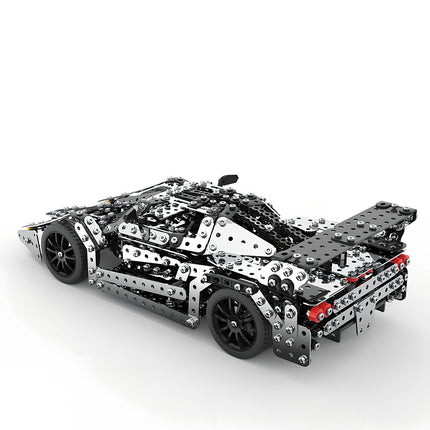 Side-rear view of a sleek metal model race car, showcasing its sophisticated mechanical steampunk construction and design. This 3D puzzle metal kit offers an engaging steampunk puzzle experience for vehicle enthusiasts.