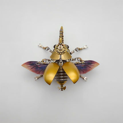 This is a Tablefunny steampunk mechanical beetle 3D metal puzzle kit: Made of gold and silver metal, it replicates the beetle’s form, featuring a shiny gold curved shell paired with transparent wings with purple gradient, plus a mechanical pointed cone head. Gears, axles and other components are densely arranged on the body and multiple legs, with exquisite craftsmanship and rich details
