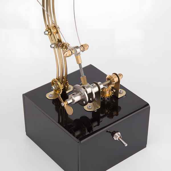 Detailed view of the mechanical base for a steampunk butterfly metal model, an impressive funny table display mechanism. This DIY 3D puzzle metal kit's base features gears and levers, showcasing functional artistry