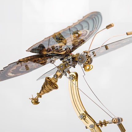 Close-up of an intricate steampunk dragonfly metal model, a detailed funny table accent. This DIY 3D puzzle metal kit showcases fine craftsmanship and mechanical artistry