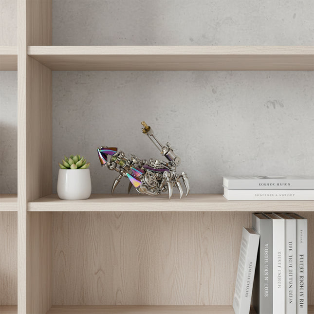 A detailed steampunk mech crab maquette en metal, featuring iridescent accents, sits on a light wooden shelf. This intricate 3D metal model kit offers a unique steampunk puzzle, displayed next to a potted succulent and books, perfect for home decor.