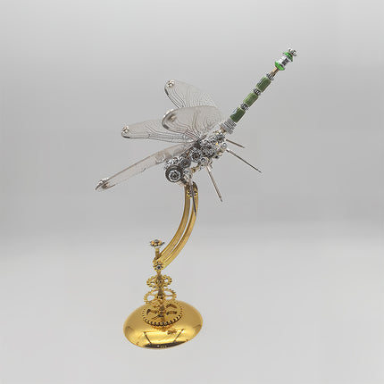 This is a finished display of Tablefunny’s steampunk dragonfly 3D metal puzzle: Crafted from silver and gold-toned metal, the dragonfly’s wings replicate fine textures, with gears and other mechanical components embedded in its body, and green accents on the tail. It pairs with a gold curved stand base (featuring gear details), capturing the dragonfly’s agile posture. Blending metallic texture and decorative appeal, it’s a creative craft ideal for desktop display.