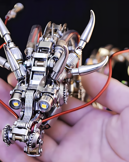 A hand gently holding the detailed head of a metallic dragon model, highlighting its intricate components, horns, and glowing eyes. This small yet complex metal model is a rewarding DIY project, perfect for adding a touch of a funny table aesthetic to any space, available in our 3D puzzle metal kits.
