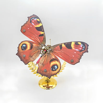 Vibrant red steampunk puzzle butterfly metal model, a detailed 3D puzzle Metal Kit for enthusiasts of mechanical steampunk aesthetics.