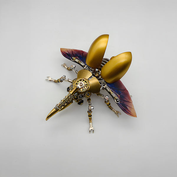 This is a Tablefunny steampunk mechanical beetle 3D metal puzzle kit: Made of gold and silver metal, it replicates the beetle’s form, featuring a shiny gold curved shell paired with transparent wings with purple gradient, plus a mechanical long-beak head. Gears, axles and other components are densely arranged on the body and multiple legs, with exquisite craftsmanship and rich details.