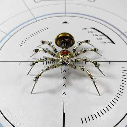  A completed steam punk mech spider model, a finely crafted metal kit with articulating legs and a striking red central gem, ready for display.