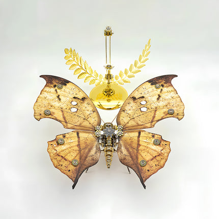 A breathtaking overhead view of a stunning steampunk puzzle, a magnificent mechanical butterfly with wide, distinctive brown and naturalistic patterned wings, showcased majestically above an ornate golden stand with laurel details. This symmetrical metal model highlights profound mechanical steampunk design, making it an impressive 3D puzzle Metal Kit for hobbyists or a captivating steampunk mech display piece that embodies intricate beauty and advanced engineering from above.