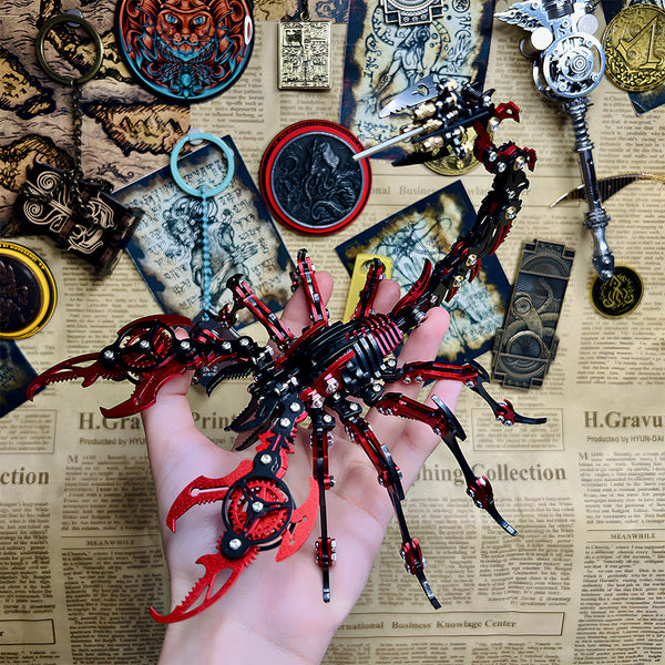 Hand holding a detailed red and black mechanical scorpion metal model, highlighting its intricate design and portable size. This captivating DIY 3D puzzle from our Metal Kits collection makes a unique and funny table display or desk ornament