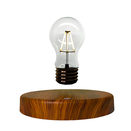 Floating vintage Edison-style bulb lamp with wireless power and natural wood stand