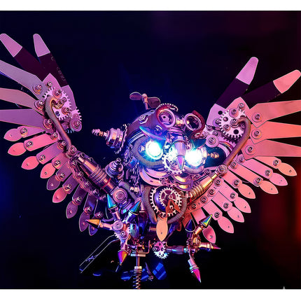 Front view of an illuminated metal model kit owl with glowing eyes, a visually striking metallic 3D puzzle and an impressive maquette en métal.