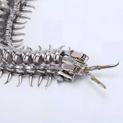  Close-up of the mechanical head and body of a centipede metal model, an intricate DIY 3D puzzle from Tablefunny metal kits.
