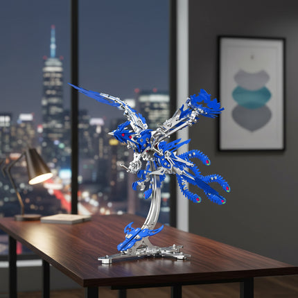 A stunning blue mechanical phoenix, a detailed metal model kit, displayed on a desk against a nighttime city skyline. This metallic 3D puzzle makes for an impressive piece of decor.

