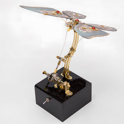 Dynamic Red Butterfly's punk-inspired butterfly metal model with mechanical base—a captivating and whimsical desktop art piece. This DIY 3D assembly metal kit blends aesthetic appeal with engineering charm.