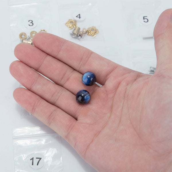 Showcasing a key decorative component for a steampunk puzzle. These unique parts are included in the metal model kit, adding a vibrant touch to the intricate mechanical steampunk design of the final 3D puzzle Metal Kit or steampunk mech. Numbered parts bags are visible in the background, indicating an assembly project.