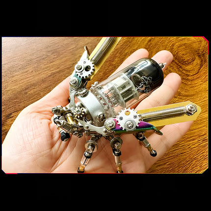  Hand holding a "Mechanical Firefly" metal model, showcasing a compact and detailed 3D puzzle for steampunk and mechanical art lovers.