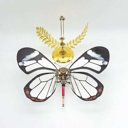 Overhead view of a stunning steampunk puzzle butterfly metal model with clear and dark-edged wings, an engaging 3D puzzle Metal Kit demonstrating innovative mechanical steampunk design.