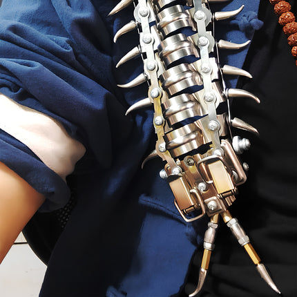 Close-up of a steampunk centipede metal model on a person's shoulder, a unique DIY 3D puzzle from Tablefunny.