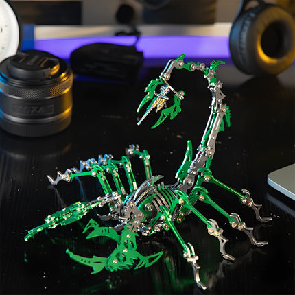 A vibrant green and silver mechanical steampunk scorpion metal model displayed on a desk, a stunning 3D puzzle Metal Kit for steampunk puzzle fans.