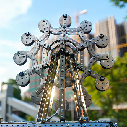 Showing off a finished steampunk puzzle Ferris wheel, a high-quality result of our DIY 3D puzzle Metal Kits.