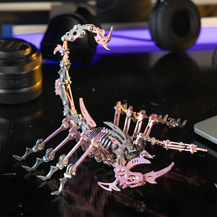 An elegant pink and silver mechanical steampunk scorpion metal model on a modern desk, a unique 3D puzzle Metal Kit from Tablefunny.