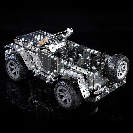 A premium metal model of an off-road jeep on a black reflective surface, showcasing the intricate mechanical steampunk design of our 3D puzzle Metal Kits.