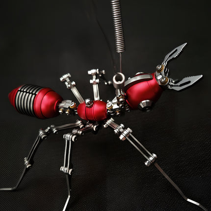 Close-up of a red mechanical steampunk ant with precision silver joints, an intricate steampunk puzzle for adult collectors.