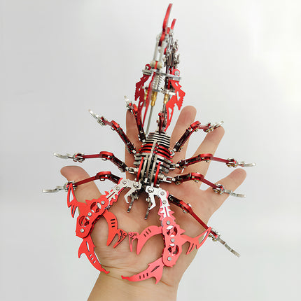 Handheld scale demonstration of a red mechanical steampunk scorpion metal model, an engaging DIY project from our premium 3D puzzle Metal Kits.