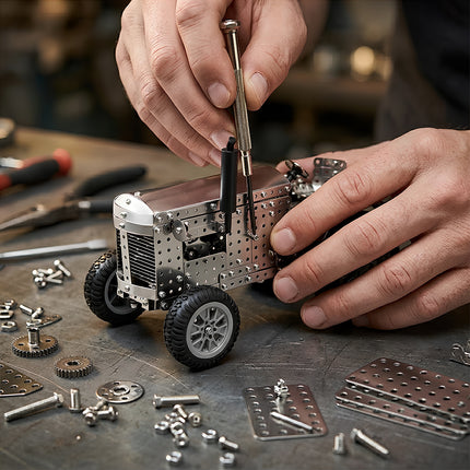 Hands crafting a steam punk mech style tractor, showcasing the professional DIY experience of mechanical steampunk metal model kits.