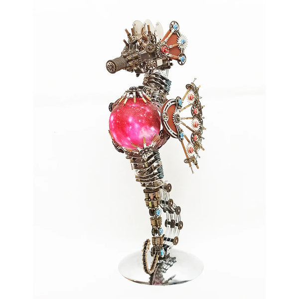 Side profile of a **mechanical metal puzzle** seahorse with exposed gears, holding a glowing red sphere.
