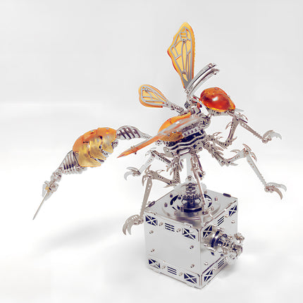 Amber orange wasp insect 3D puzzle metal kit with transparent wings and stinger on a mechanical base.