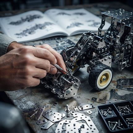 Macro close-up of hands using a precision tool to assemble the gear and bucket structure of a 3D metal wheel loader model kit.