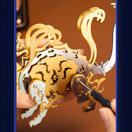 Close-up of hands using a screwdriver to assemble a mechanical steampunk Xuanwu tortoise model from 3D puzzle Metal Kits.