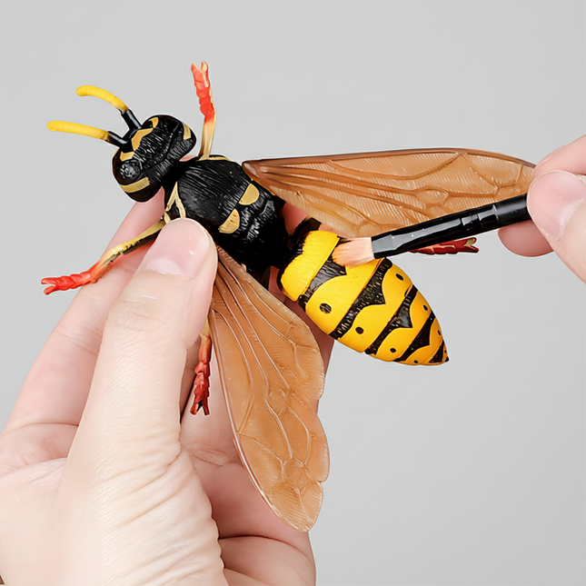 A realistic wasp model toy, classified as a static, solid early childhood educational and craft toy. Crafted from hard plastic, it faithfully replicates the biological features of a wasp: black-and-yellow striped body, transparent textured wings, yellow antennae, and red legs, with exceptionally lifelike detailing.