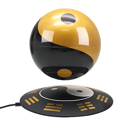 Floating Tai Chi orb on Feng Shui base, symbolizing balance and harmony for desk decor