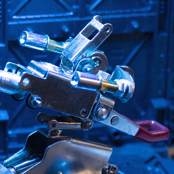 Close-up shot of precision mechanical joints and metallic components on a steam punk mech model built from 3D puzzle metal kits.